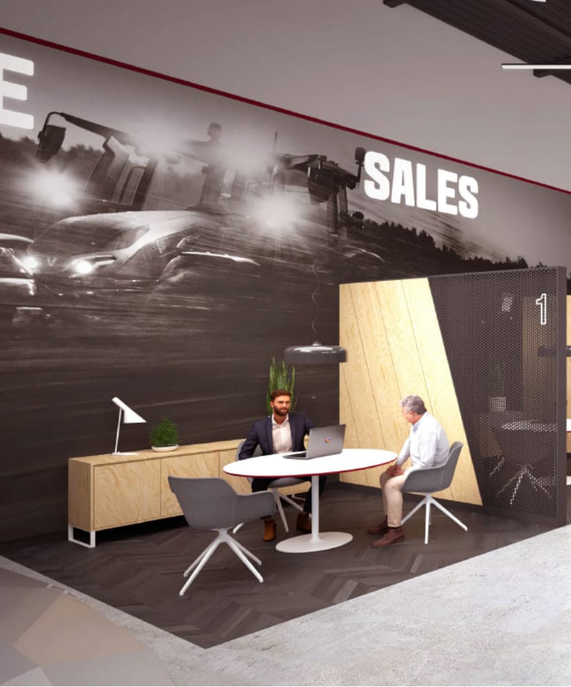 Concept visualisation of a dealership sales area, a monochrome field mural and Sales lettering above a meeting table.