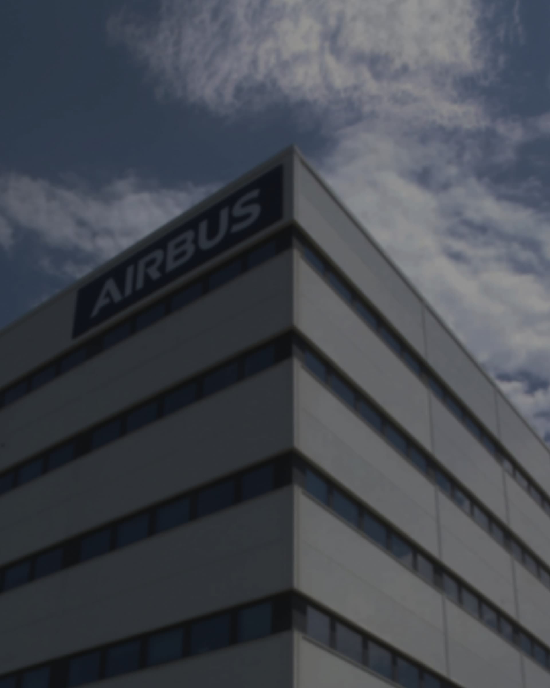 An Airbus office block, the wordmark mounted along its top floor above a glazed frontage.