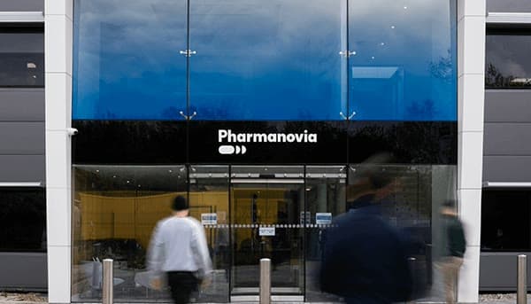Staff walking through the Pharmanovia head office entrance.