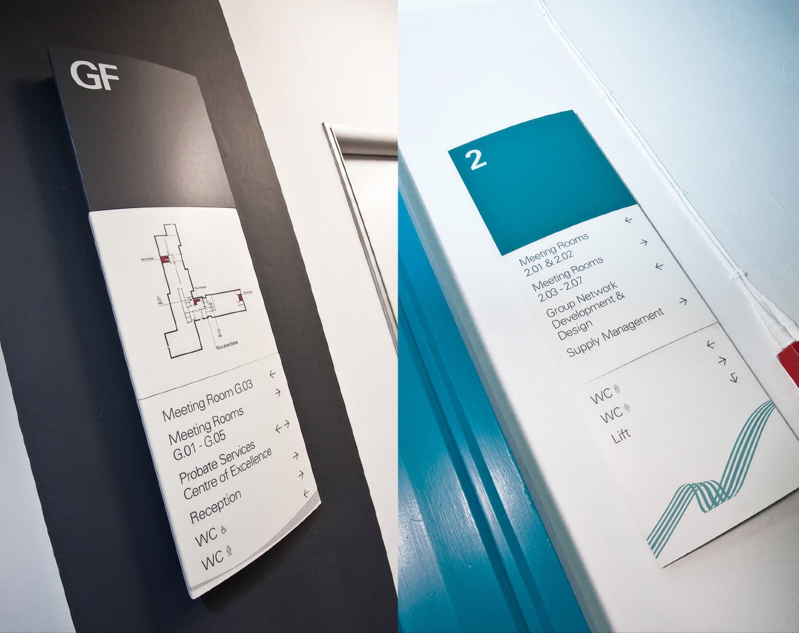 Two floor directory signs side by side, a grey ground-floor panel and a teal second-floor panel listing meeting rooms.