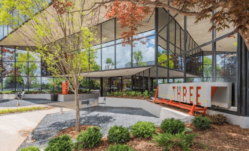 The glass-fronted office building housing GLIMMA's Greenville team