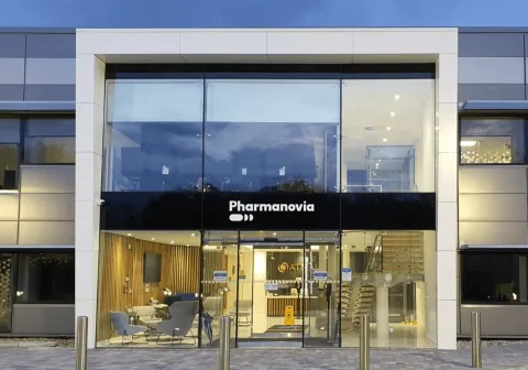 The Pharmanovia wordmark on the glazed frontage of its head office