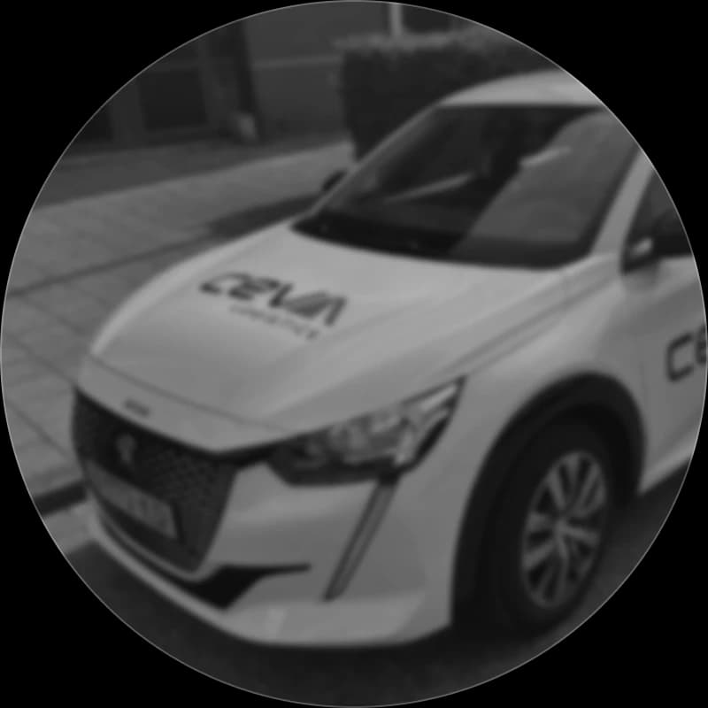 A CEVA Logistics branded electric company car parked at the kerb