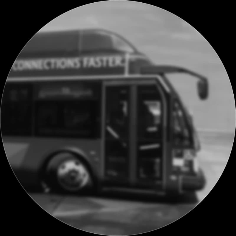 A branded shuttle bus with its passenger doors open