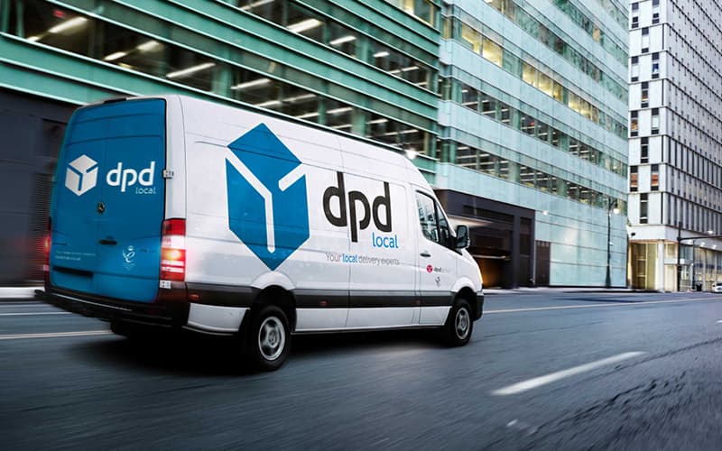 DPD Local van driving through a city street