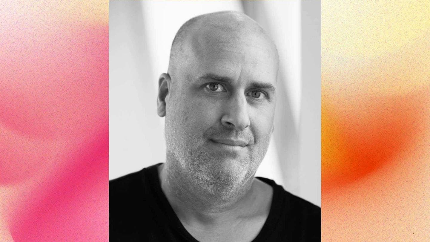 Black and white portrait of Adam Pinsley, GLIMMA Creative Lead