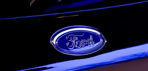 The Ford oval badge on a dealership fascia
