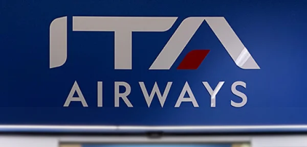 ITA Airways signage at an airport terminal